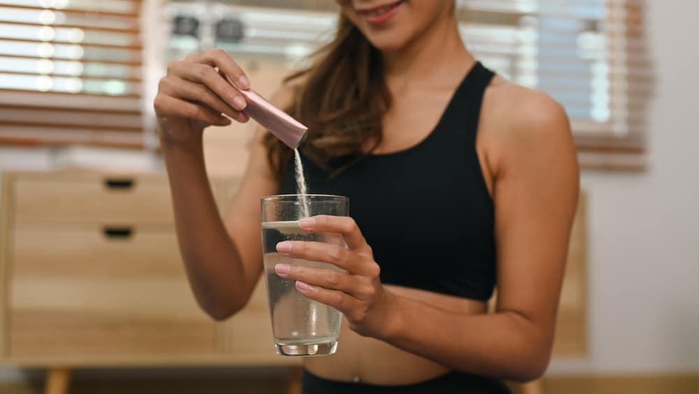 a woman about to take a joint supplement